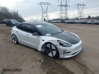 2021 Tesla Model 3 Performance with VIN 5YJ3E1EC5MF059625, listed as a IAAI auction lot 41652748 with NaN miles. Bid and sale history available at carsss.com. Image 1.