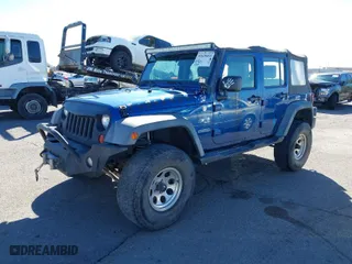 2010 Jeep Wrangler Unlimited Sport with VIN 1J4BA3H19AL197779, listed as a IAAI auction lot 41620455 with 161,697 mi miles. Bid and sale history available at carsss.com. Image 2.