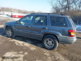 2002 Jeep Grand Cherokee Laredo with VIN 1J4GW48NX2C243282, listed as a IAAI auction lot 41362493 with 201,932 mi miles. Bid and sale history available at carsss.com. Image 3.
