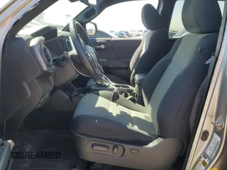 2021 Toyota Tacoma 4WD SR5 with VIN 3TMDZ5BN9MM099787, listed as a Copart auction lot 49717425 with 56,374 mi miles and Salvage Title. Bid and sale history available at carsss.com. Image 7.