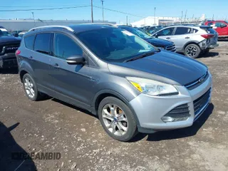 2014 Ford Escape Titanium with VIN 1FMCU9JX1EUB94776, listed as a IAAI auction lot 42063678 with 138,036 mi miles. Bid and sale history available at carsss.com. Image 1.