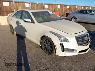 2014 Cadillac CTS Luxury AWD z VIN 1G6AX5SX3E0149360, wystawiony jako IAAI lot #41020479 z przebiegiem 98 917 mil mil oraz . Historia ofert i sprzedaży dostępna na DreamBid. Obrazek 1.