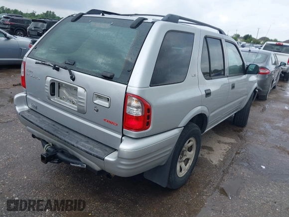 2001 Isuzu Rodeo S with VIN 4S2DM58WX14352481, listed as a IAAI auction lot 42152621 with 162,696 mi miles. Bid and sale history available at carsss.com. Image 4.