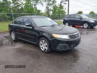 2010 Kia Optima LX z VIN KNAGG4A8XA5415091, wystawiony jako IAAI lot #42239766 z przebiegiem 243 556 mil mil oraz . Historia ofert i sprzedaży dostępna na DreamBid. Obrazek 1.