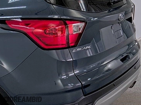 2019 Ford Escape SE z VIN 1FMCU9GD9KUA54757, wystawiony jako IAAI lot #42516631 z przebiegiem 87 040 mil mil oraz . Historia ofert i sprzedaży dostępna na DreamBid. Obrazek 20.