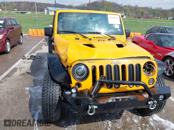 2013 Jeep Wrangler Unlimited Sport z VIN 1C4BJWDG6DL544197, wystawiony jako IAAI lot #41968556 z przebiegiem 121 101 mil mil oraz . Historia ofert i sprzedaży dostępna na DreamBid. Obrazek 13.