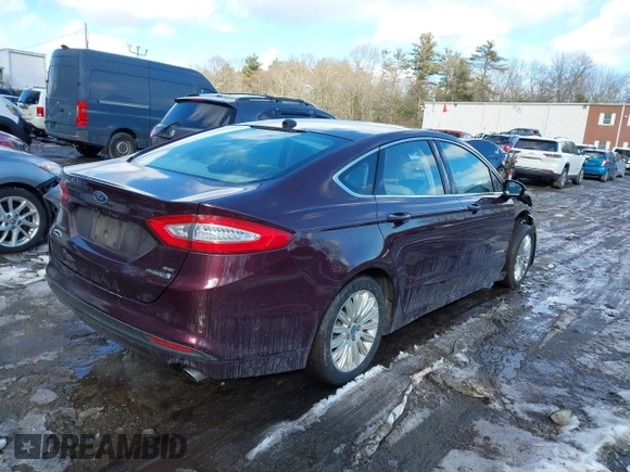 2013 Ford Fusion SE Hybrid z VIN 3FA6P0LU1DR251738, wystawiony jako IAAI lot #41576698 z przebiegiem 158 735 mil mil oraz . Historia ofert i sprzedaży dostępna na DreamBid. Obrazek 4.