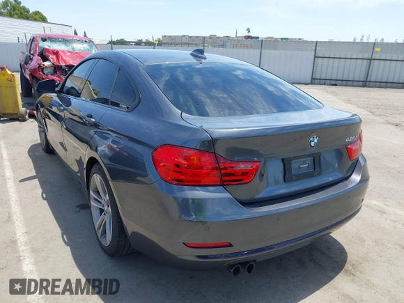 2015 BMW 4 Series 428i with VIN WBA4A5C59FG052596, listed as a IAAI auction lot 42649927 with 68,842 mi miles and . Bid and sale history available at DreamBid. Image 3.