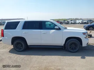 2020 Chevrolet Tahoe Commercial with VIN 1GNSKDEC8LR258254, listed as a IAAI auction lot 42104608 with 105,895 mi miles. Bid and sale history available at carsss.com. Image 14.
