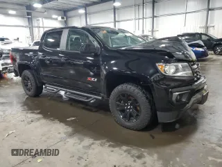 2021 Chevrolet Colorado 4WD Z71 with VIN 1GCGTDEN8M1171810, listed as a Copart auction lot 57409115 with 100,579 mi miles and Salvage title. Bid and sale history available at DreamBid. Image 4.
