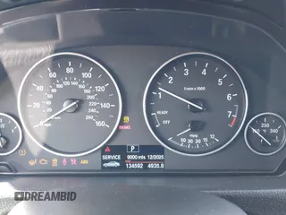 2013 BMW 3 Series 320i with VIN WBA3B1C57DF461779, listed as a IAAI auction lot 41991156 with 134,592 mi miles. Bid and sale history available at carsss.com. Image 7.