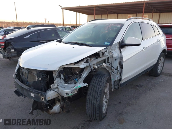 2015 Cadillac SRX with VIN 3GYFNAE34FS557297, listed as a IAAI auction lot 41388573 with 124,185 mi miles and . Bid and sale history available at DreamBid. Image 2.