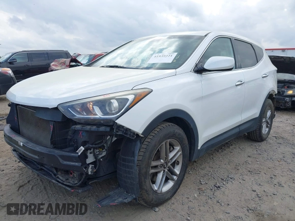 2018 Hyundai Santa Fe 2.4L z VIN 5NMZTDLB9JH060895, wystawiony jako IAAI lot #41939221 z przebiegiem 89 960 mil mil oraz . Historia ofert i sprzedaży dostępna na DreamBid. Obrazek 2.