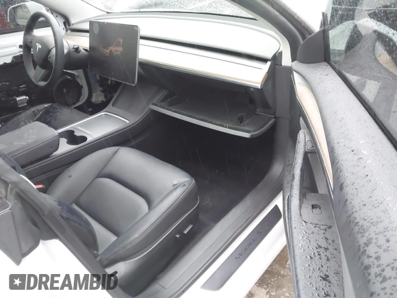 2023 Tesla Model 3 with VIN 5YJ3E1EA8PF578199, listed as a IAAI auction lot 41735465 with 50,823 mi miles and . Bid and sale history available at DreamBid. Image 5.