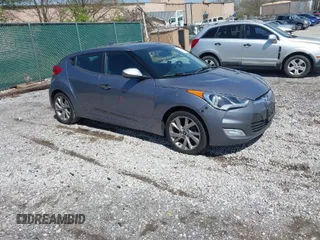 2017 Hyundai Veloster with VIN KMHTC6AD8HU305853, listed as a IAAI auction lot 41915404 with 115,663 mi miles. Bid and sale history available at carsss.com. Image 1.