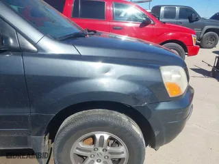 2004 Honda Pilot EX with VIN 2HKYF18574H532409, listed as a IAAI auction lot 41701760 with 302,949 mi miles. Bid and sale history available at carsss.com. Image 6.