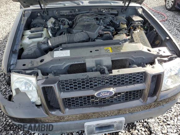 2005 Ford Explorer Sport Trac XLS z VIN 1FMZU67K65UA70362, wystawiony jako Copart lot #50586995 z przebiegiem 207 077 mil mil oraz Szkoda całkowita • Salvage title. Historia ofert i sprzedaży dostępna na DreamBid. Obrazek 11.