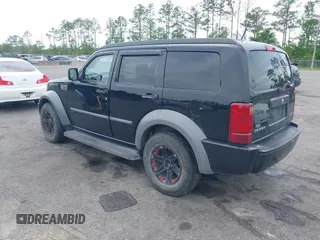 2007 Dodge Nitro SXT with VIN 1D8GT28K17W605984, listed as a IAAI auction lot 41970841 with 118,700 mi miles. Bid and sale history available at carsss.com. Image 3.