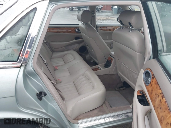 1998 Jaguar XJ with VIN SAJHN1242WC819689, listed as a IAAI auction lot 41148530 with 60,143 mi miles and . Bid and sale history available at DreamBid. Image 8.