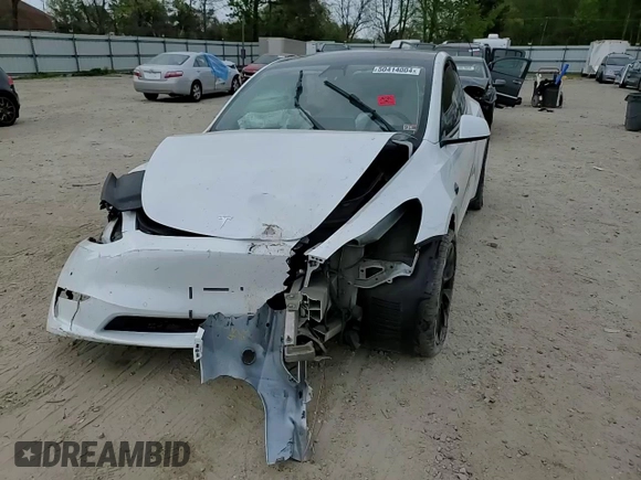 2021 Tesla Model Y Standard Range z VIN 5YJYGDED1MF109091, wystawiony jako Copart lot #50414004 z przebiegiem Nie podano mil oraz Szkody całkowita. Historia ofert i sprzedaży dostępna na DreamBid. Obrazek 11.
