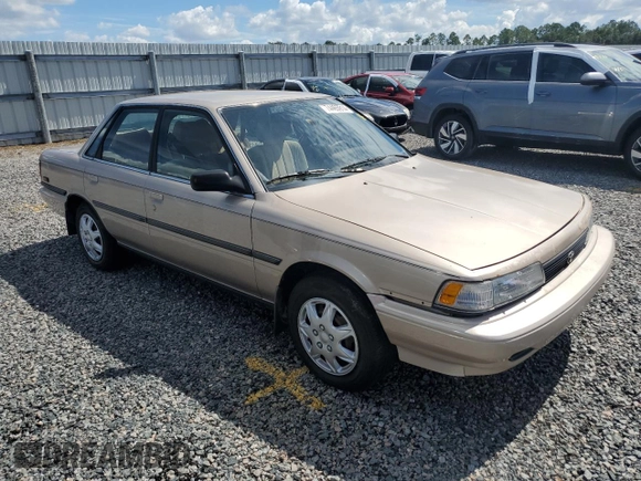 1991 Toyota Camry DLX z VIN 4T1SV21E5MU415356, wystawiony jako Copart lot #74465914 z przebiegiem 74 592 mil mil oraz Szkoda całkowita • Salvage title. Historia ofert i sprzedaży dostępna na DreamBid. Obrazek 4.
