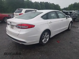 2018 Ford Fusion SE z VIN 3FA6P0H75JR159448, wystawiony jako IAAI lot #42262839 z przebiegiem 144 353 mil mil oraz . Historia ofert i sprzedaży dostępna na DreamBid. Obrazek 4.