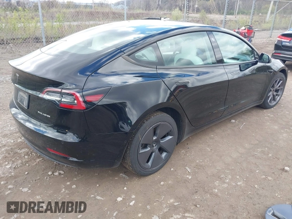2021 Tesla Model 3 Long Range with VIN 5YJ3E1EB7MF052988, listed as a IAAI auction lot 42052662 with 29,877 mi miles and . Bid and sale history available at carsss.com. Image 4.
