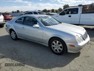 2000 Mercedes-Benz CLK 320/430 with VIN WDBLJ65G8YF122308, listed as a Copart auction lot 77449314 with 105,121 mi miles and Salvage Title. Bid and sale history available at DreamBid. Image 4.