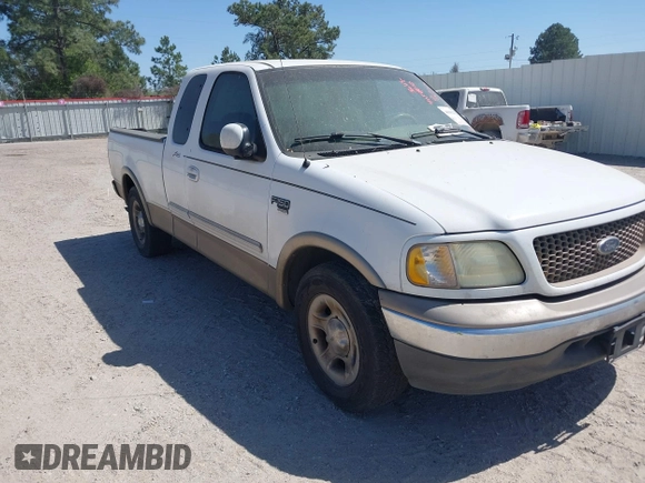 2003 Ford F-150 XL with VIN 1FTRX17L03NA16778, listed as a IAAI auction lot 41602179 with 219,101 mi miles. Bid and sale history available at carsss.com. Image 1.