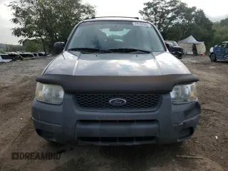 2004 Ford Escape XLS with VIN 1FMYU92104KA21454, listed as a Copart auction lot 74139564 with 217,731 mi miles and Salvage Title. Bid and sale history available at carsss.com. Image 5.