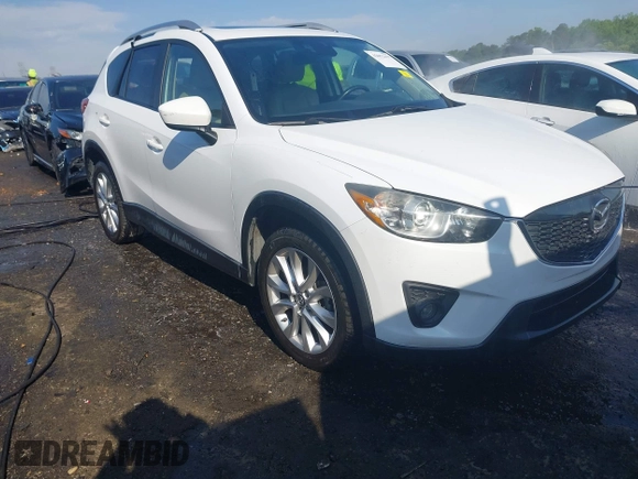2014 Mazda CX-5 Grand Touring with VIN JM3KE2DY1E0424890, listed as a IAAI auction lot 42052437 with 107,793 mi miles. Bid and sale history available at carsss.com. Image 1.
