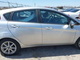 2019 Ford Fiesta SE with VIN 3FADP4EJ0KM148614, listed as a IAAI auction lot 41860070 with 68,361 mi miles and . Bid and sale history available at DreamBid. Image 14.