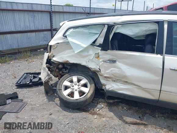 2014 Chevrolet Traverse LTZ with VIN 1GNKRJKD2EJ287211, listed as a IAAI auction lot 39873394 with 128,355 mi miles and . Bid and sale history available at DreamBid. Image 13.