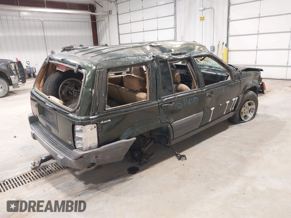 1997 Jeep Grand Cherokee Laredo z VIN 1J4GZ58YXVC729117, wystawiony jako IAAI lot #42244799 z przebiegiem Nie podano mil oraz . Historia ofert i sprzedaży dostępna na DreamBid. Obrazek 4.