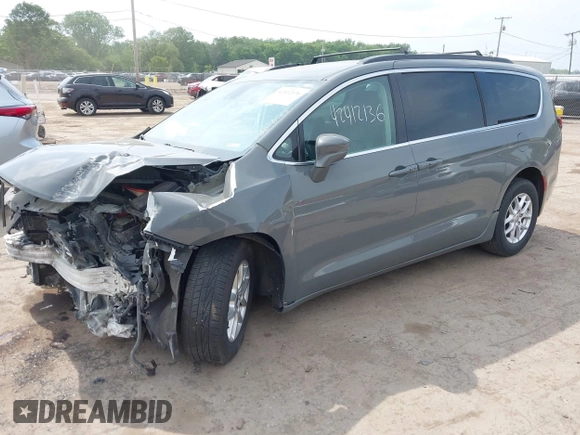 2022 Chrysler Pacifica Touring L with VIN 2C4RC1BG9NR142830, listed as a IAAI auction lot 42412136 with 104,964 mi miles and . Bid and sale history available at DreamBid. Image 2.