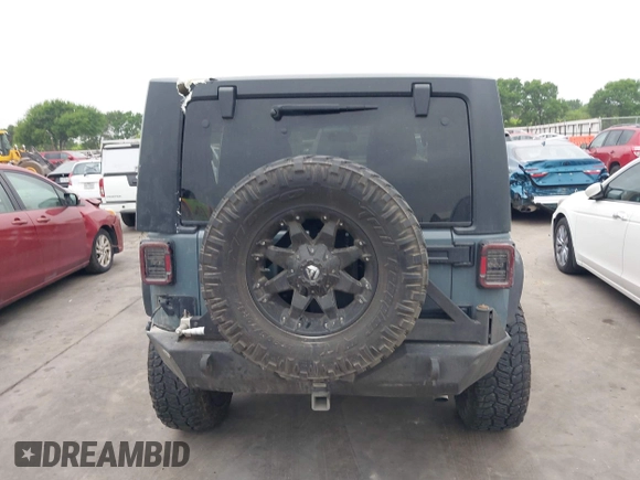 2015 Jeep Wrangler Sport with VIN 1C4GJWAG7FL585631, listed as a IAAI auction lot 41943582 with 88,649 mi miles and . Bid and sale history available at DreamBid. Image 16.