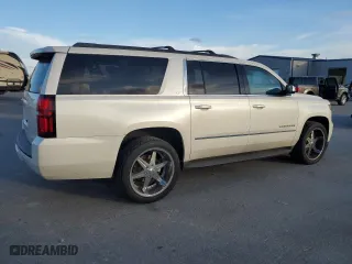2015 Chevrolet Suburban LT with VIN 1GNSKJKC2FR638780, listed as a Copart auction lot 47360345 with 156,884 mi miles and Salvage Title. Bid and sale history available at carsss.com. Image 3.