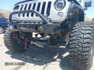 2018 Jeep Wrangler Unlimited Sport with VIN 1C4BJWDG4JL807265, listed as a IAAI auction lot 42520648 with 69,229 mi miles and . Bid and sale history available at DreamBid. Image 6.