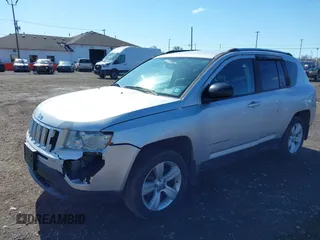 2012 Jeep Compass Sport with VIN 1C4NJDBB0CD590268, listed as a IAAI auction lot 41856474 with 148,627 mi miles. Bid and sale history available at carsss.com. Image 2.