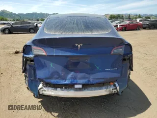 2021 Tesla Model Y Long Range with VIN 5YJYGDEE7MF114420, listed as a Copart auction lot 53889365 with 74,363 mi miles and Salvage Title. Bid and sale history available at DreamBid. Image 6.