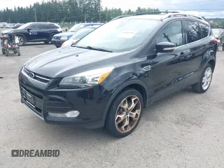 2013 Ford Escape Titanium with VIN 1FMCU9J98DUB02238, listed as a IAAI auction lot 42609782 with 168,574 mi miles and . Bid and sale history available at DreamBid. Image 2.