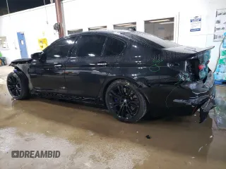 2018 BMW M5 z VIN WBSJF0C51JB282271, wystawiony jako Copart lot #60647265 z przebiegiem 63 765 mil mil oraz Szkoda całkowita • Salvage title. Historia ofert i sprzedaży dostępna na DreamBid. Obrazek 2.