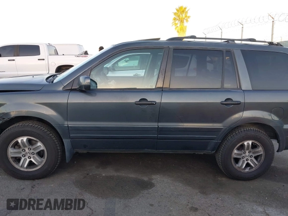 2005 Honda Pilot EX-L z VIN 2HKYF187X5H514571, wystawiony jako IAAI lot #41746538 z przebiegiem 276 994 mil mil oraz . Historia ofert i sprzedaży dostępna na DreamBid. Obrazek 14.