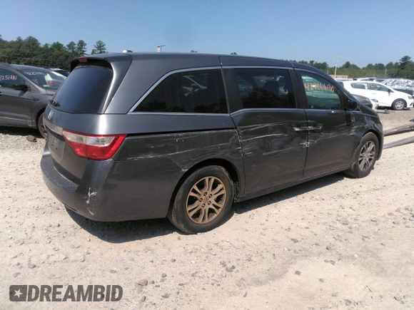 2012 Honda Odyssey EX-L with VIN 5FNRL5H63CB137198, listed as a IAAI auction lot 42706690 with 305,753 mi miles and . Bid and sale history available at DreamBid. Image 4.