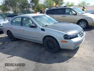 2001 Nissan Maxima SE with VIN JN1CA31D11T838425, listed as a IAAI auction lot 42004862 with 148,813 mi miles and . Bid and sale history available at DreamBid. Image 1.