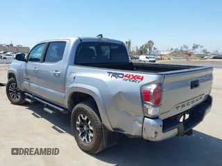 2021 Toyota Tacoma SR with VIN 3TMCZ5AN6MM393306, listed as a IAAI auction lot 42094095 with 57,217 mi miles and . Bid and sale history available at DreamBid. Image 3.