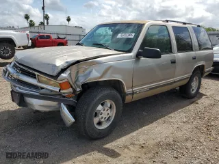 1999 Chevrolet Tahoe Z71 with VIN 1GNEK13R0XJ444734, listed as a Copart auction lot 76323384 with 160,631 mi miles and Salvage Title. Bid and sale history available at carsss.com. Image 1.