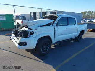 2021 Toyota Tacoma 2WD SR5 with VIN 5TFAZ5CN5MX107993, listed as a IAAI auction lot 41451061 with 37,193 mi miles. Bid and sale history available at carsss.com. Image 2.