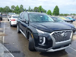 2021 Hyundai Palisade SEL z VIN KM8R44HE3MU322600, wystawiony jako IAAI lot #42282910 z przebiegiem 63 940 mil mil oraz . Historia ofert i sprzedaży dostępna na DreamBid. Obrazek 1.