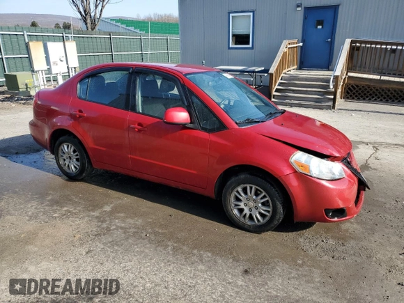 2012 Suzuki SX4 LE z VIN JS2YC5A34C6300969, wystawiony jako Copart lot #49036095 z przebiegiem 163 367 mil mil oraz Szkoda całkowita • Salvage title. Historia ofert i sprzedaży dostępna na DreamBid. Obrazek 4.